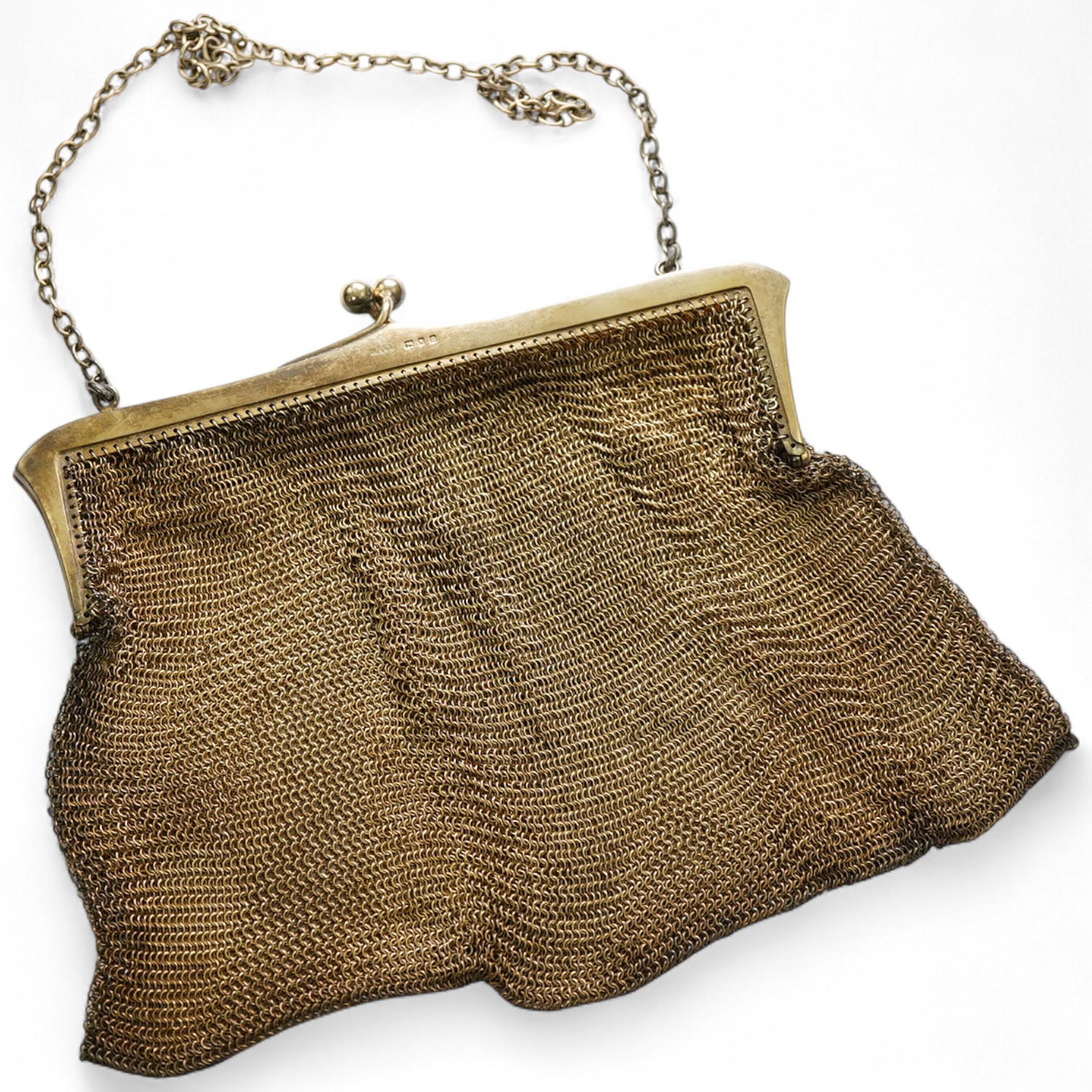 A silver purse, circa 1920, composed of chainmail, to a toggle clasp, and chain strap, in silver, purse 15.5 x 16cm, chain length 40cm, British hallmarks, date letter for 1920, sponsor's mark AM&MLd, gross weight approxi